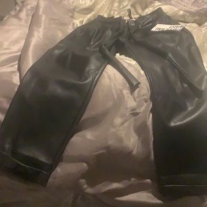 Black paper bag waist like leather pants.